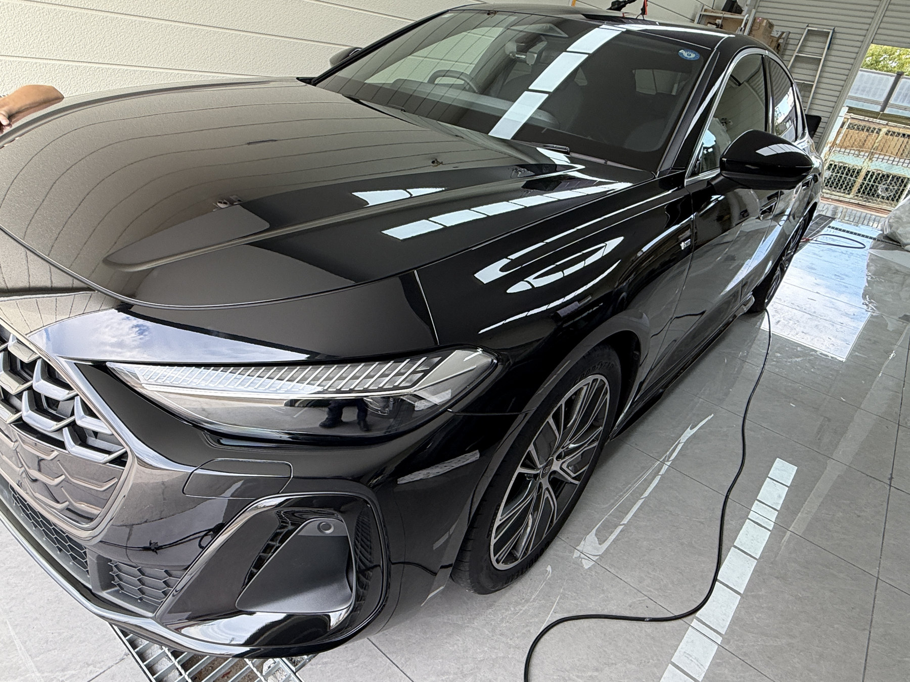After 2025 Audi A5 front bumper accent blackout wrap using 3M 2080-HG12 in Osaka