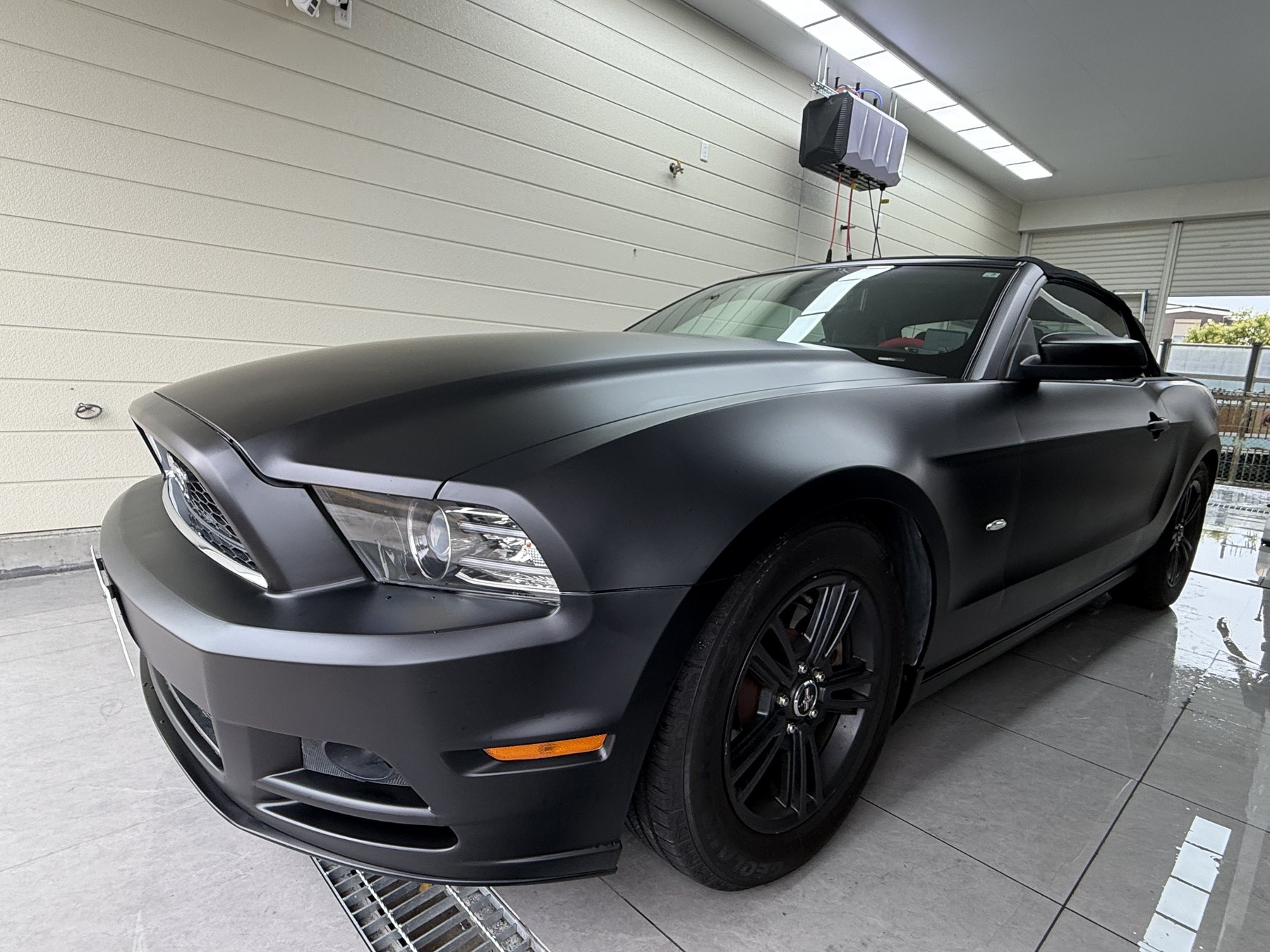 Completed Ford Mustang satin black full wrap by EISUI WRAP in Osaka
