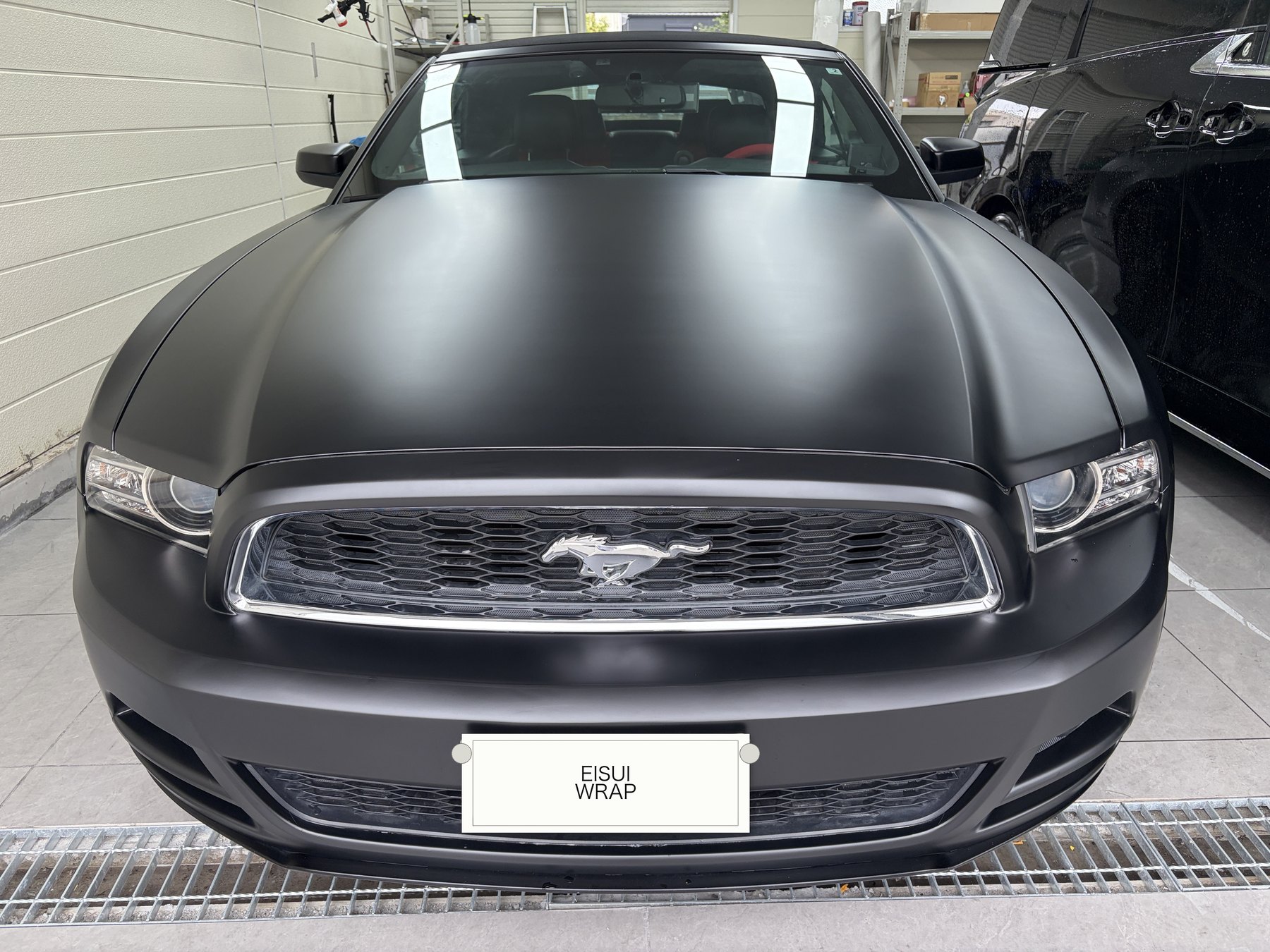 Ford Mustang after satin black wrap, front view