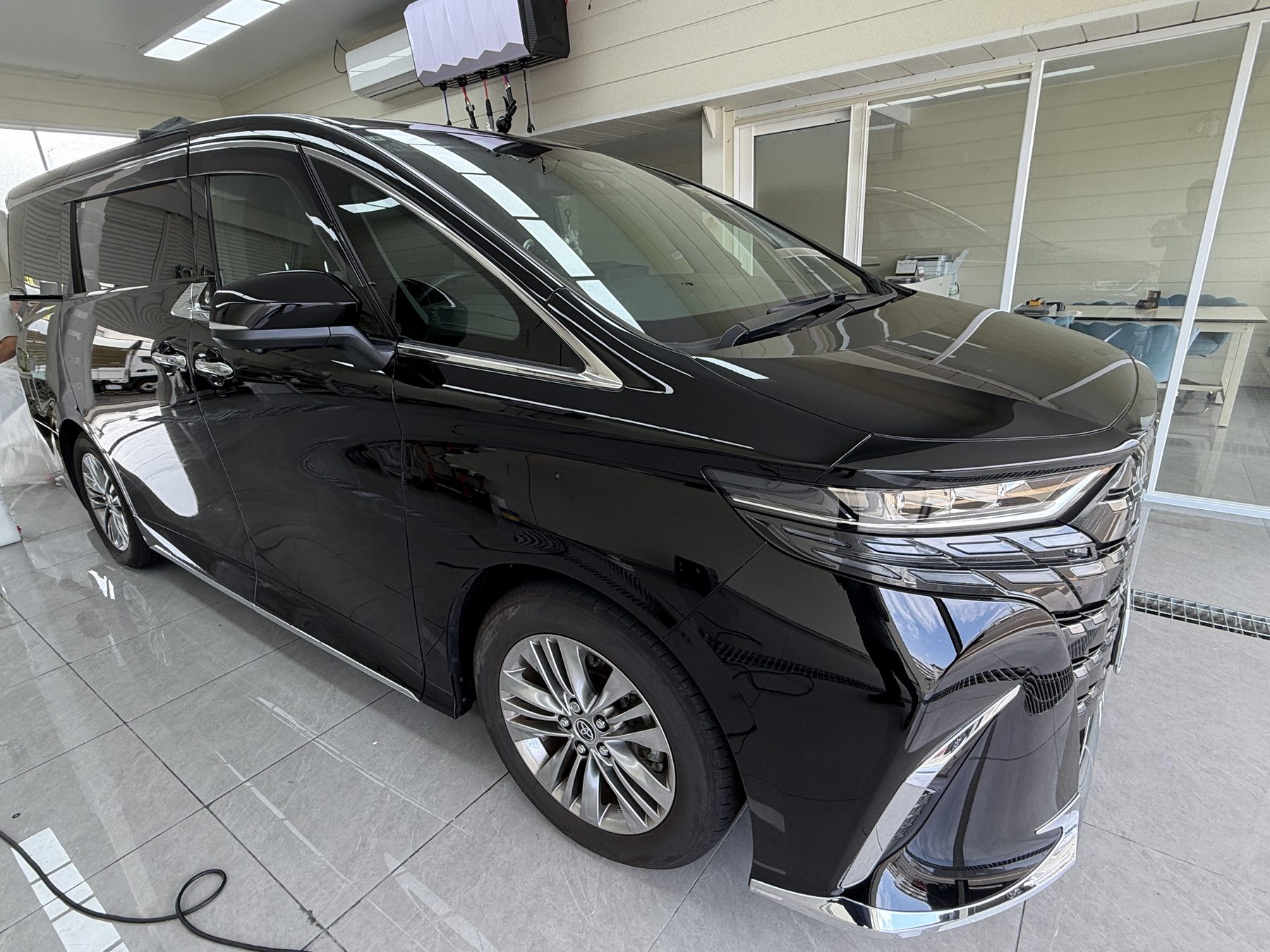 Black Toyota Alphard 40 front side after clear PPF installation in Osaka