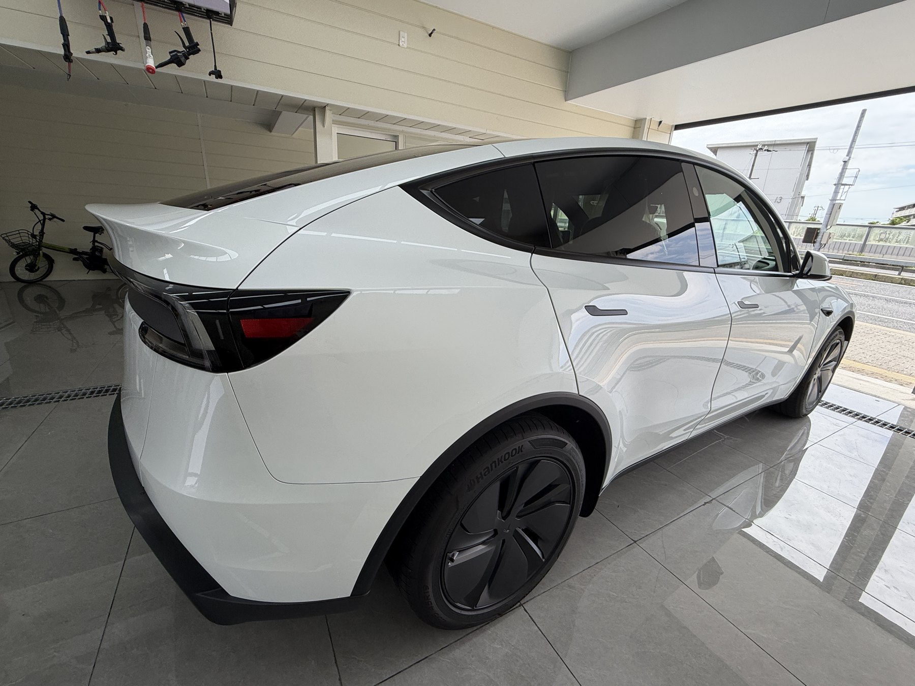Tesla Model Y before matte clear PPF rear angle gloss white
