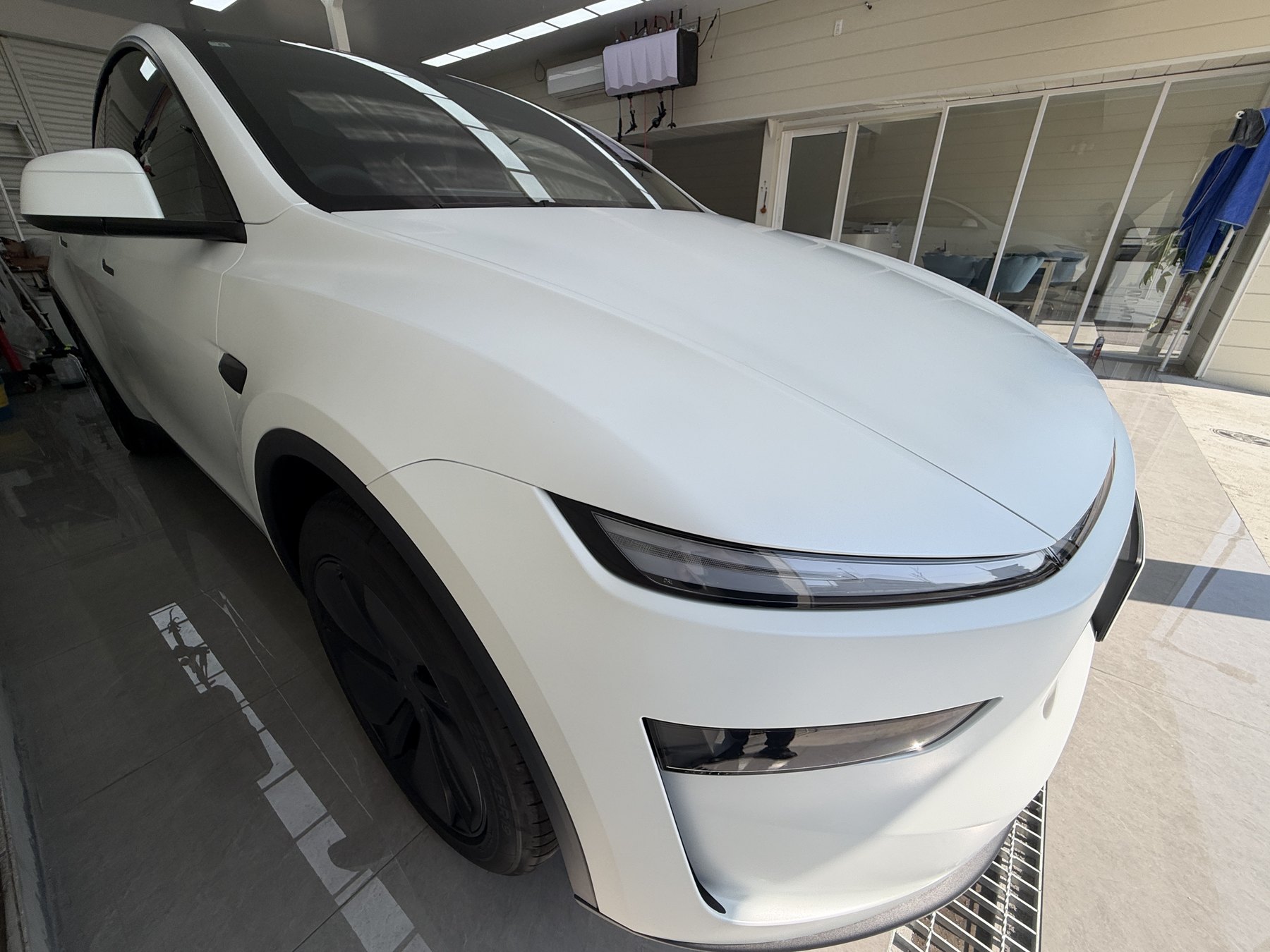 White Tesla Model Y with matte clear PPF installed in Suminoe-ku Osaka