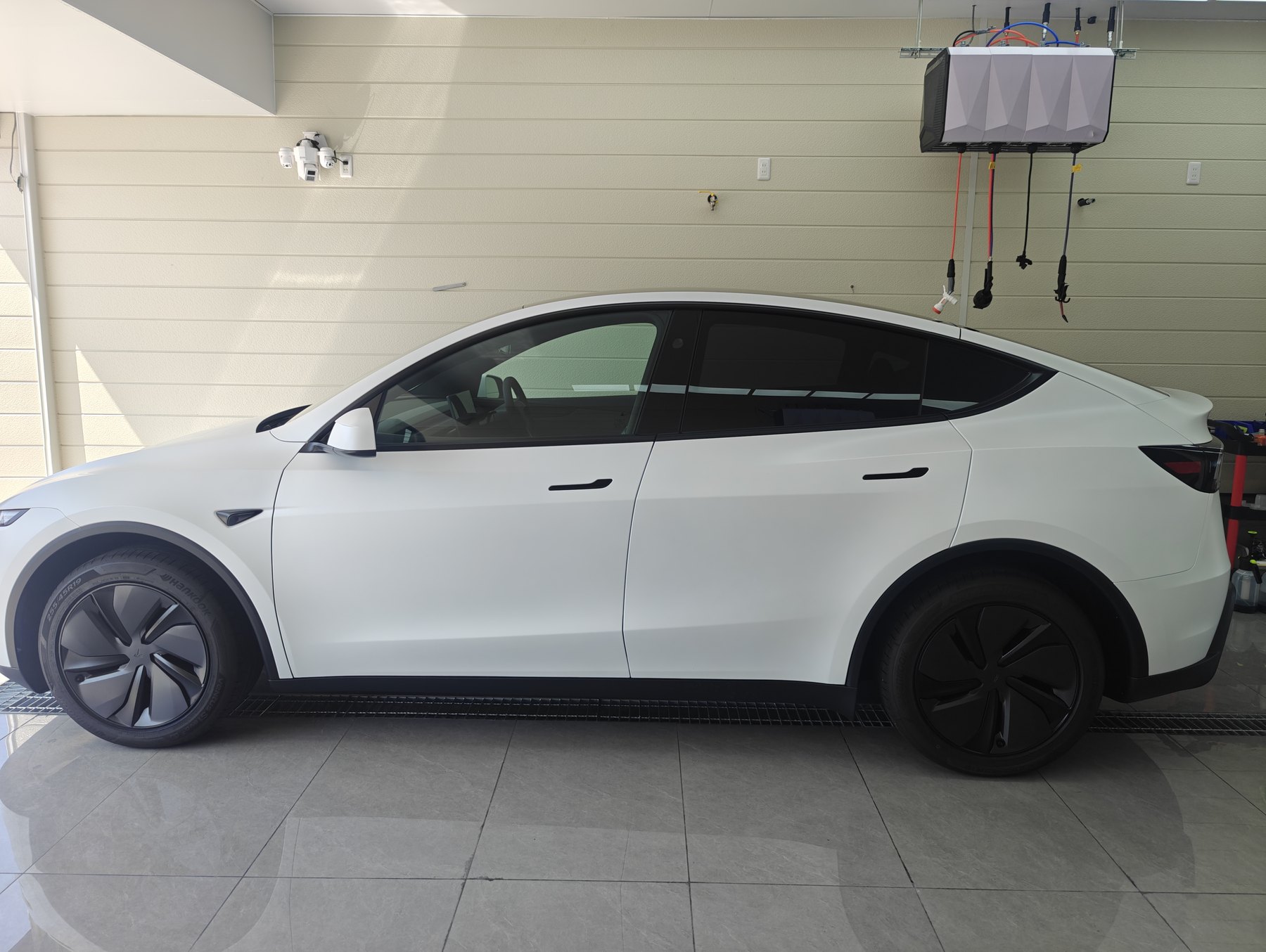 Tesla Model Y after matte clear PPF installation side view matte white