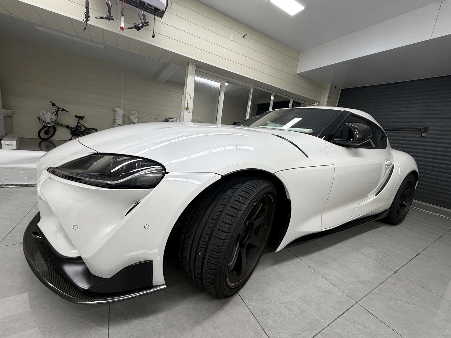 White Toyota GR Supra A90 after clear PPF installation in Osaka, front three-quarter view